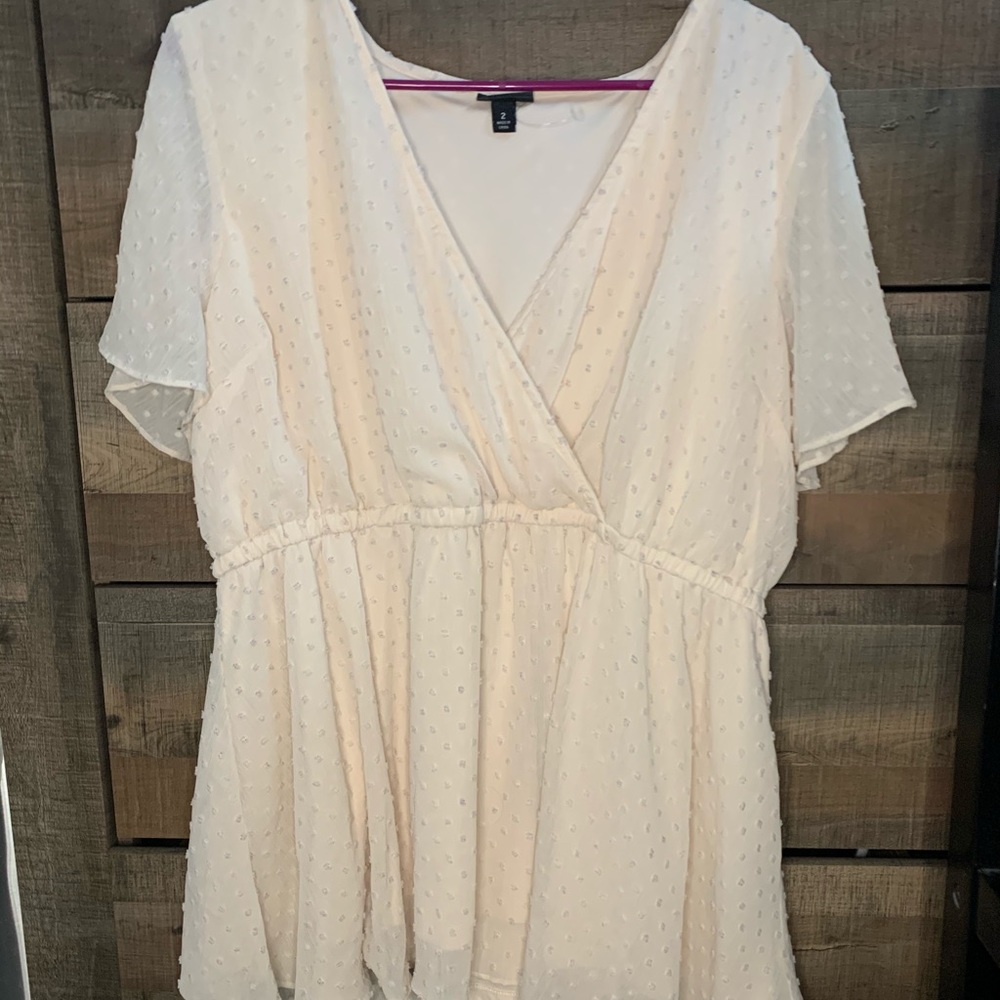 Cream colored blouse with colored dots
